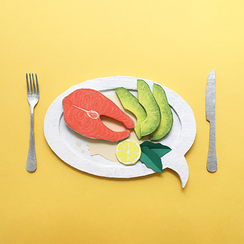 a plate of food with salmon and avacado