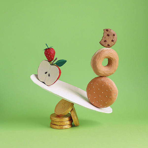 a scale with money as the foundation, apple on the left, bagel and cookie on the right. the bagel and cookie are heavier